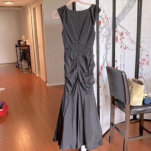 This is body-tight, size 6 by xscape n organza lining to make it fluffy poofy